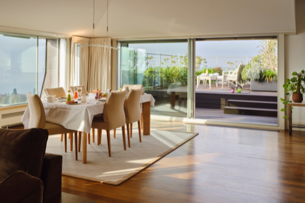 The Penthouse at Lausanne Palace, view from the living room and the suite’s panoramic terrace overlooking Lake Geneva and the Alps.